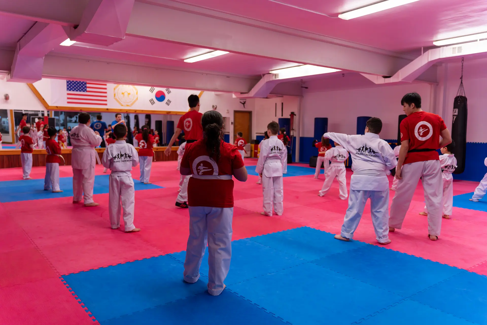 Taekwondo students training in class at JK Kang Taekwondo